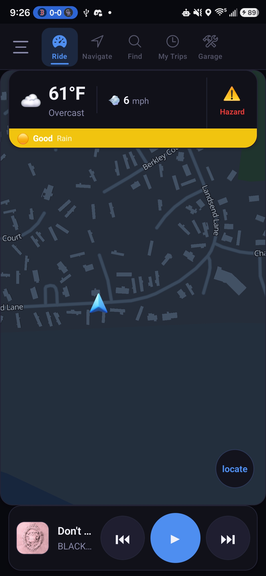 Ride tab with map, GPS arrow, weather widget, hazard alert and Spotify bar